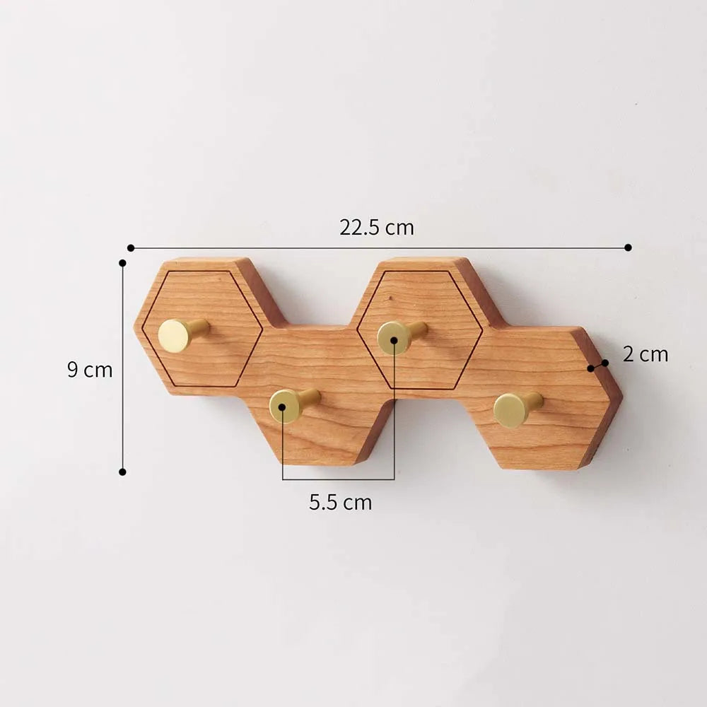 Eight-hook honeycomb wooden wall rack measuring 22.5 cm long, 9 cm high and 2 cm deep