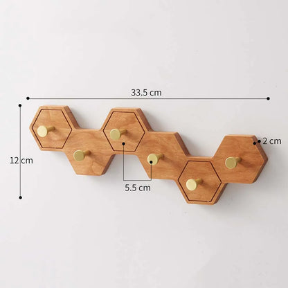 Six-hook honeycomb wooden wall rack measuring 33.5 cm long, 12 cm high and 2 cm deep