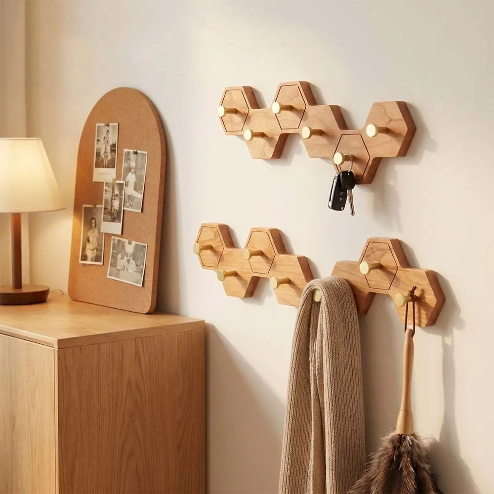 Cherry finish honeycomb wall hooks holding a coat and a scarf